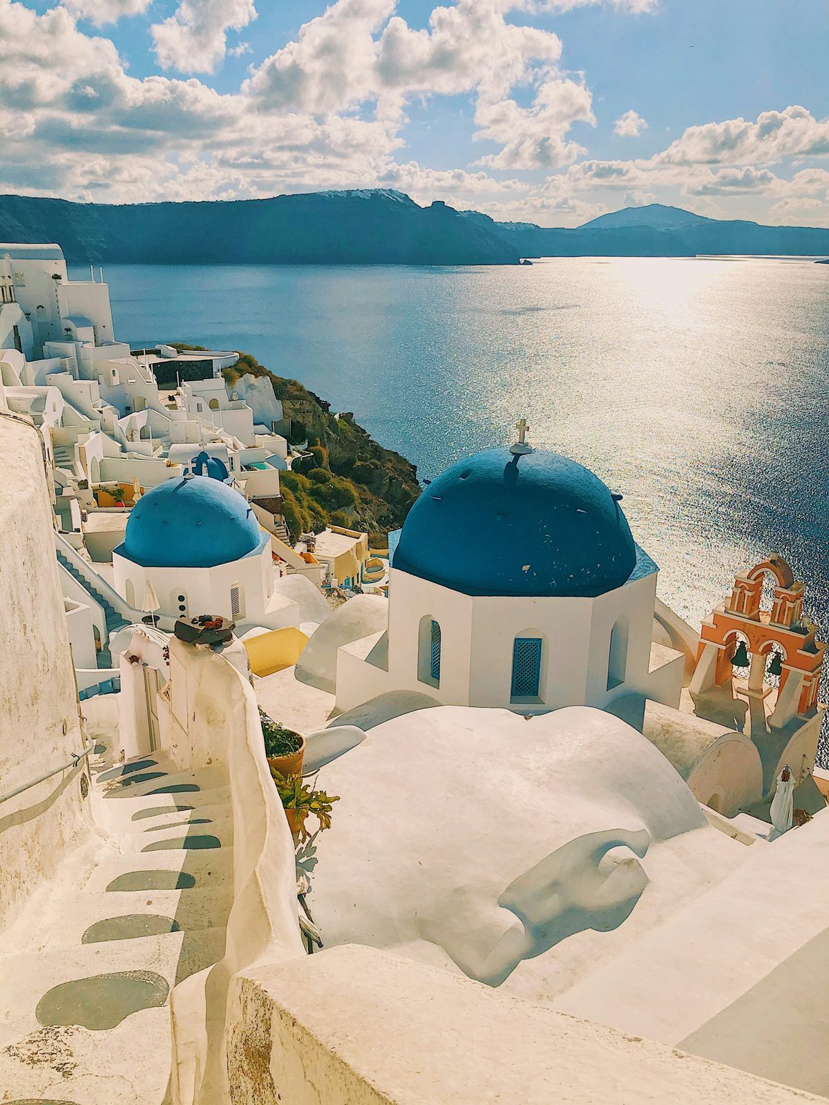 A blue-domed church above the caldera on Santorini