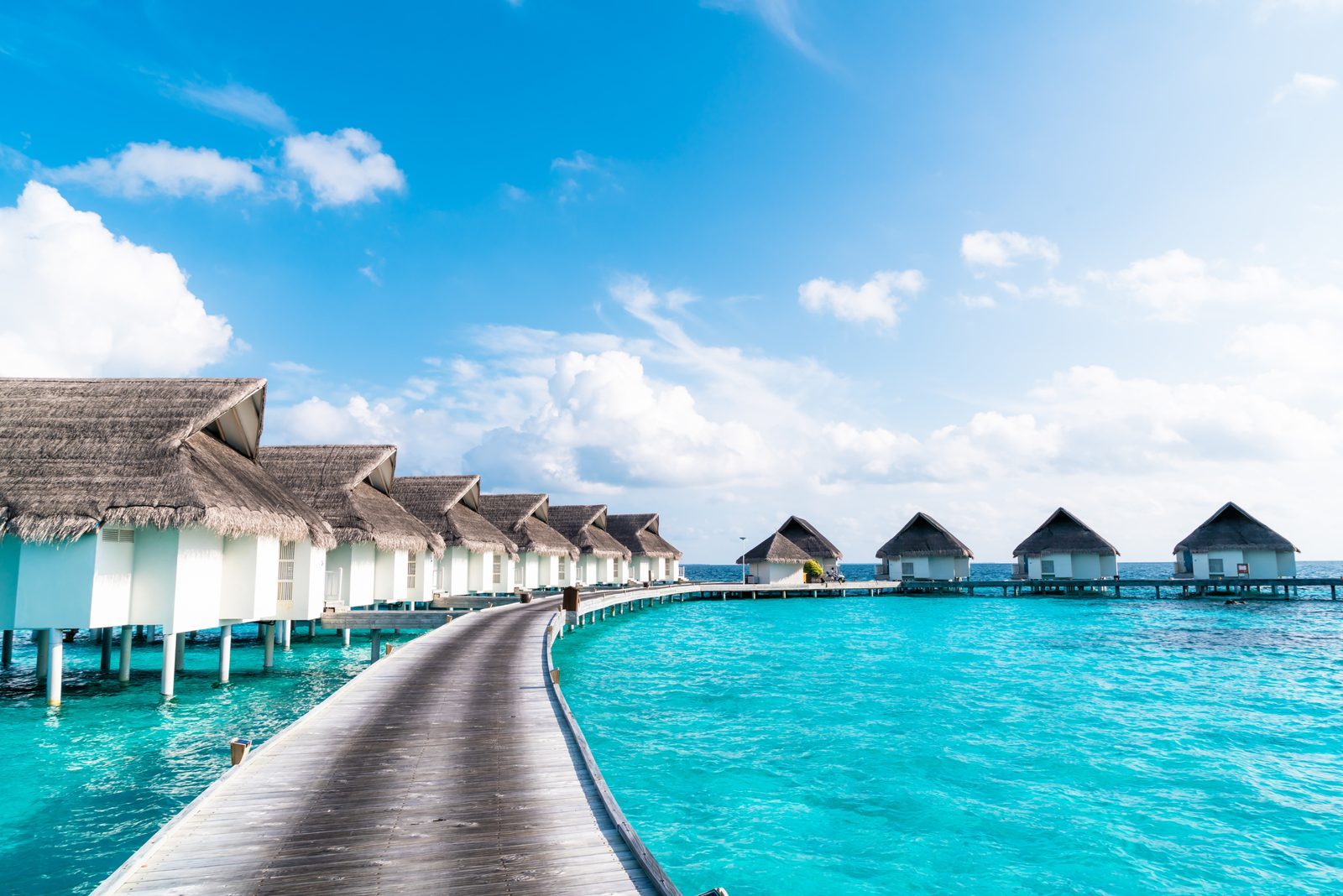 A tropical island resort surrounded by clear blue water